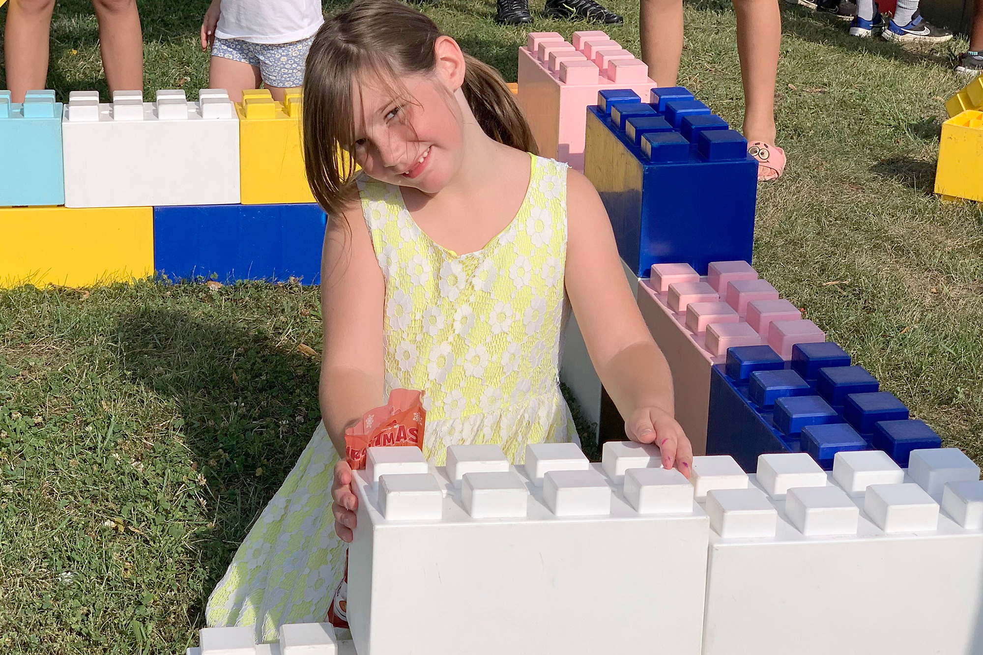 Navi Ridsdale took part in building a structure in the Creative Club Giant LEGO zone