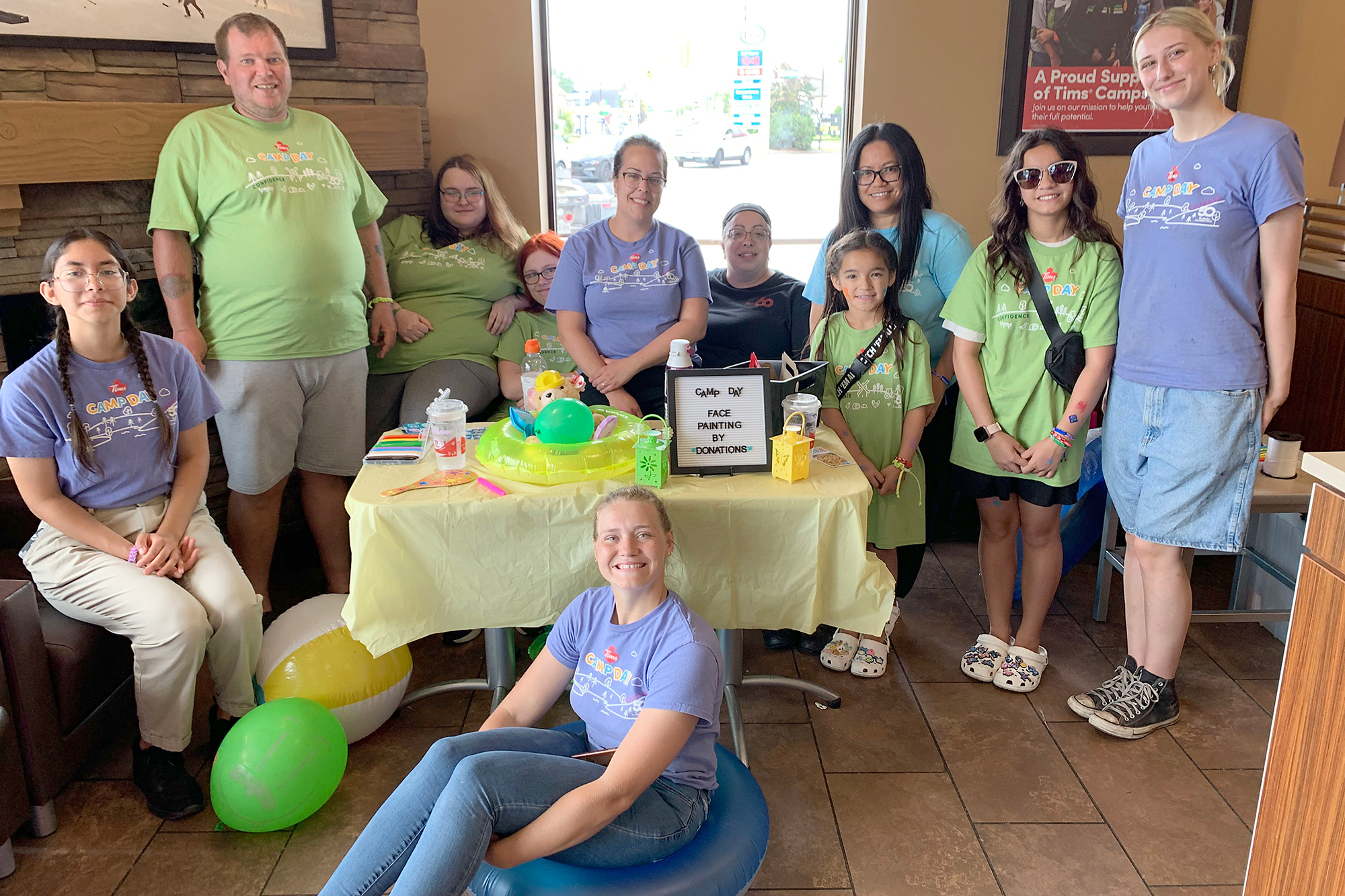 Tim Hortons Camp Day crew at the face painting table