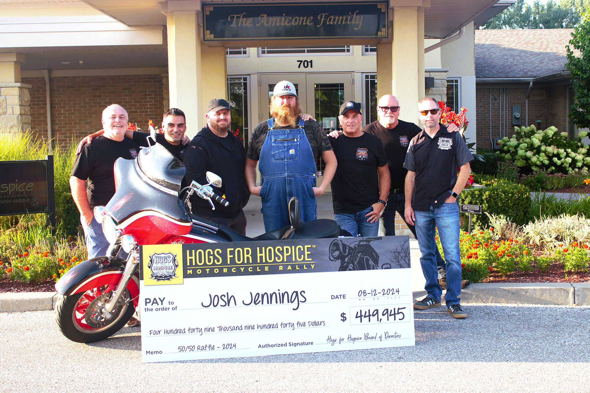 The winner met with the Hogs for Hospice board members on Monday, August 12 to receive his big cheque in front The Hospice, Erie Shores. Campus.