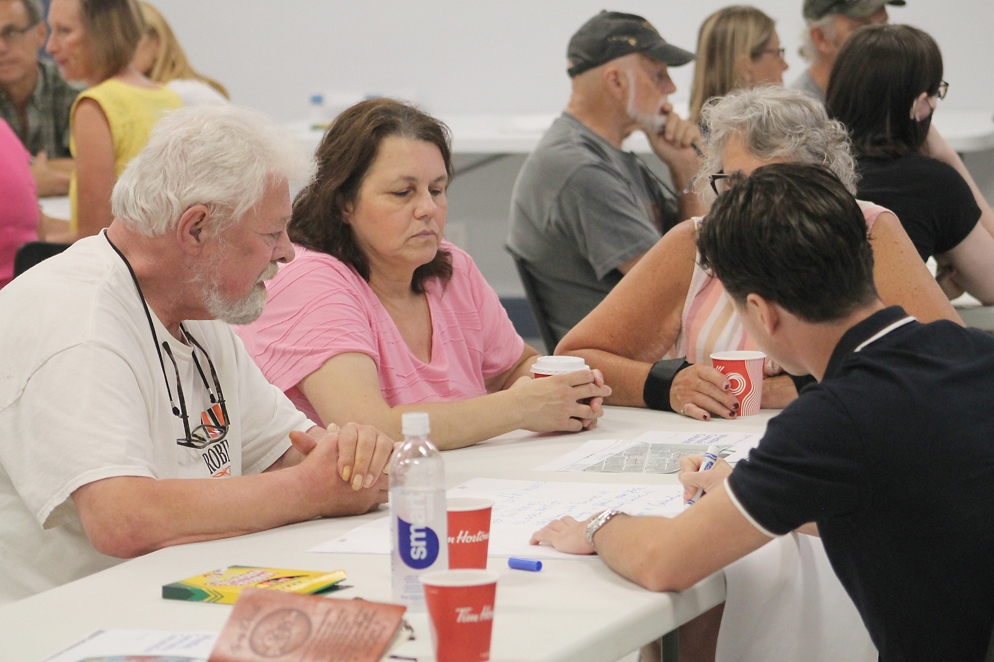 Quinn, of the Wheatley Task Force takes notes from a small group of citizens who shared their visions for the downtown revitalization.