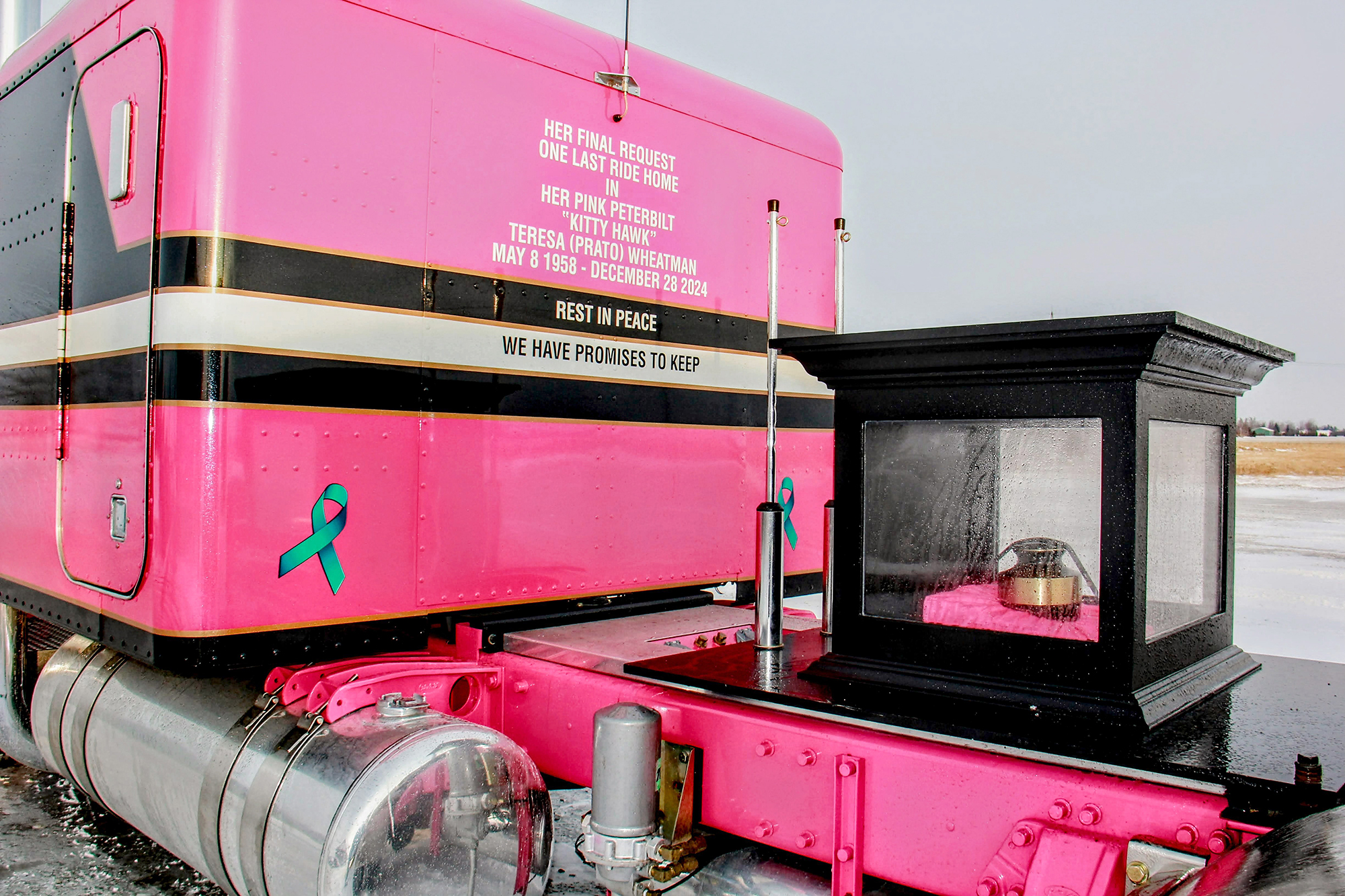 The back of Brooks Cook’s Peterbilt, adorned with a tribute to Kittyhawk and the display box for her urn.