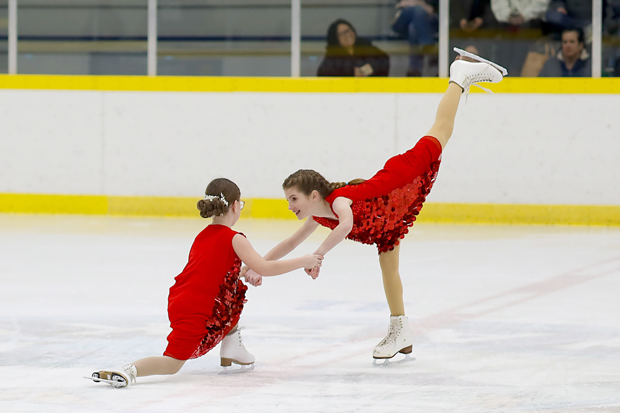 Lauren Whaling and Calleigh Bilokraly perform on ice in the showcase.