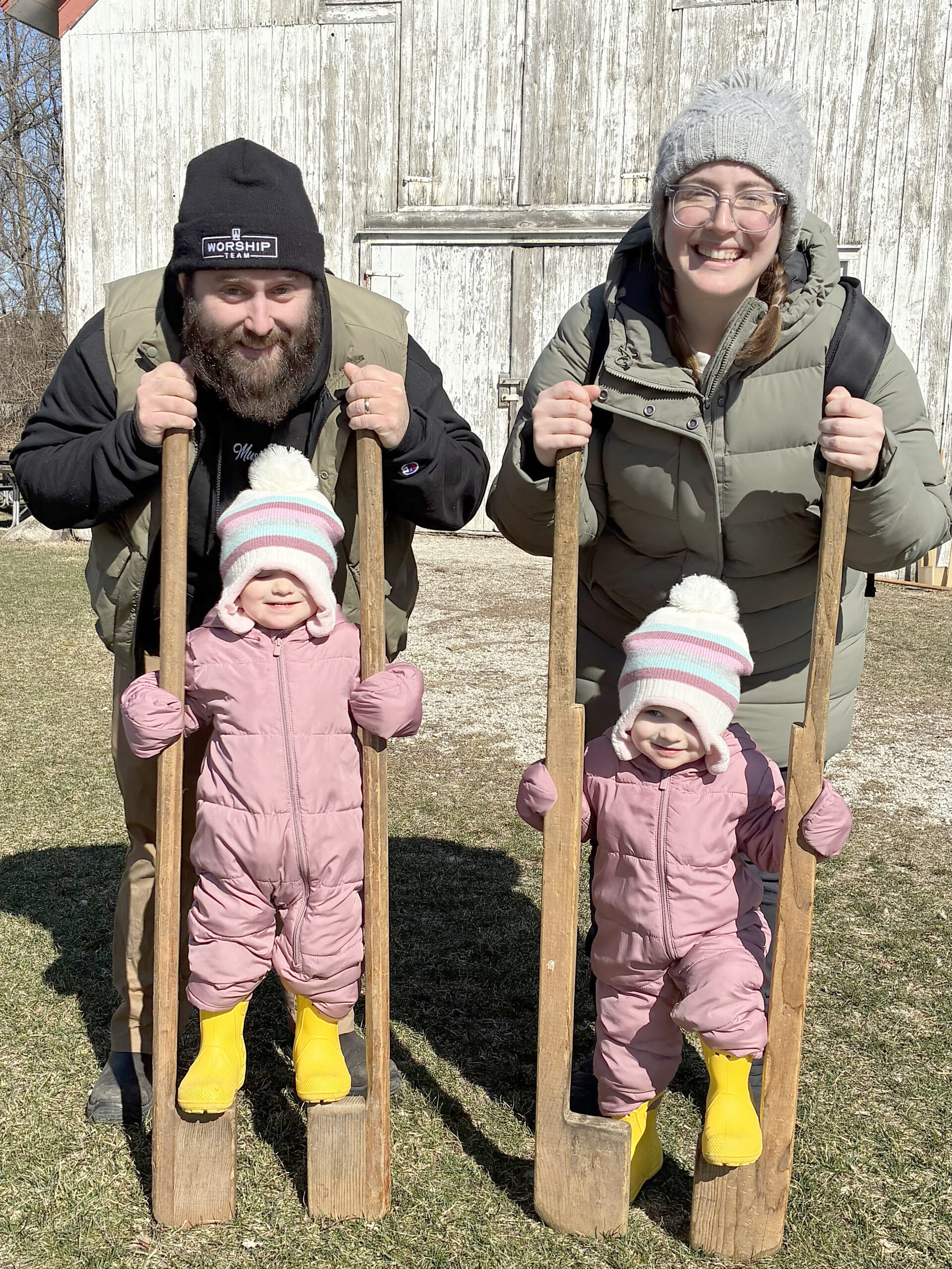 Kids were having a great time all over the grounds of the homestead on the first weekend of the Maple Syrup Festival. Two-year old twins, Noelle with dad Wesley Shuttleworth and Anna with mom Sarah, are pictured as they carefully balance themselves on a pair of stilts from long ago.