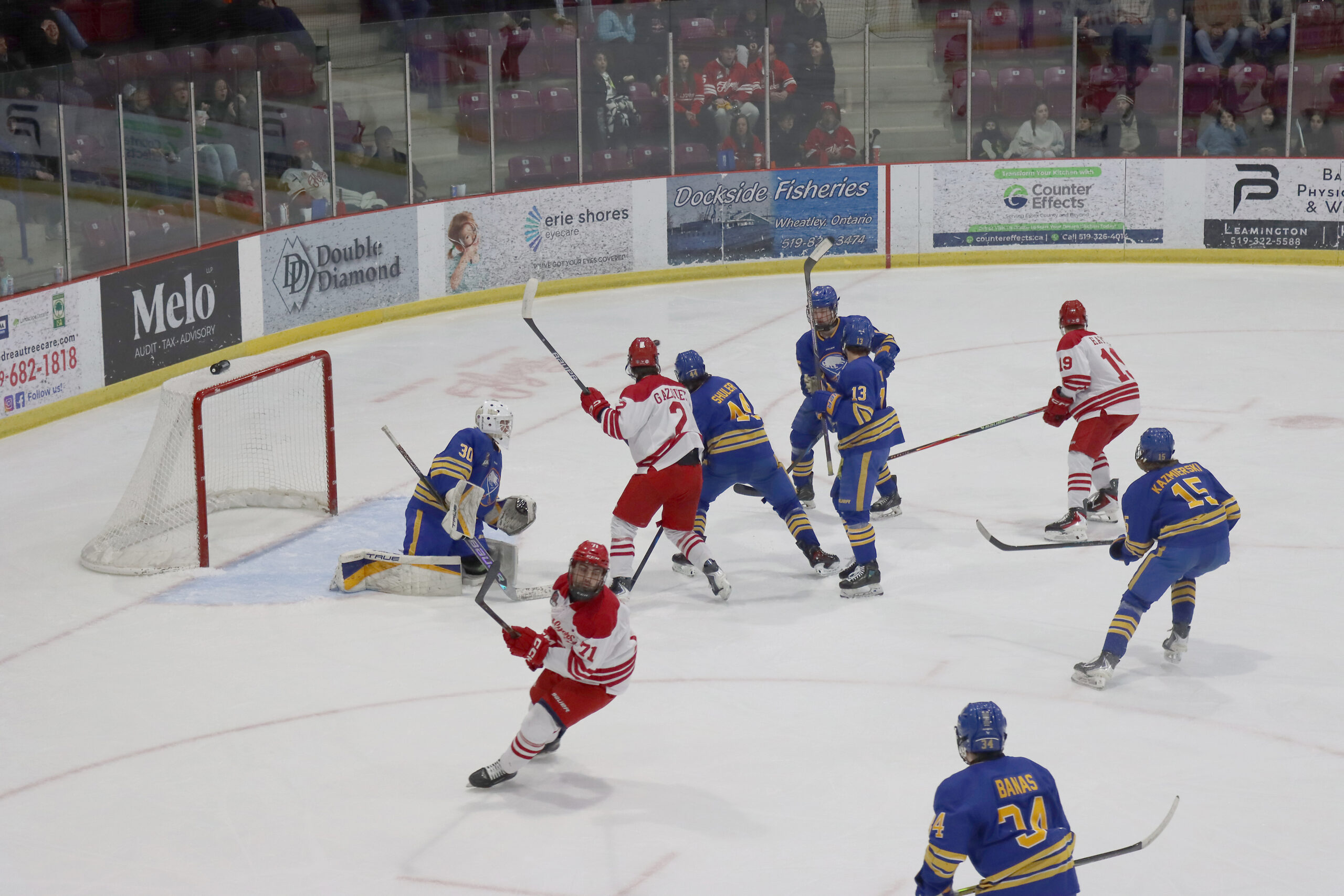 Leamington captain Adrian Bosev (71) turns away after a save by Buffalo goalie Owen Scott as his teammates Vincent Gasquez (2) and Reid Hayes (19) react during the second period of Sunday’s series-clinching game won by the Flyers 5-1.