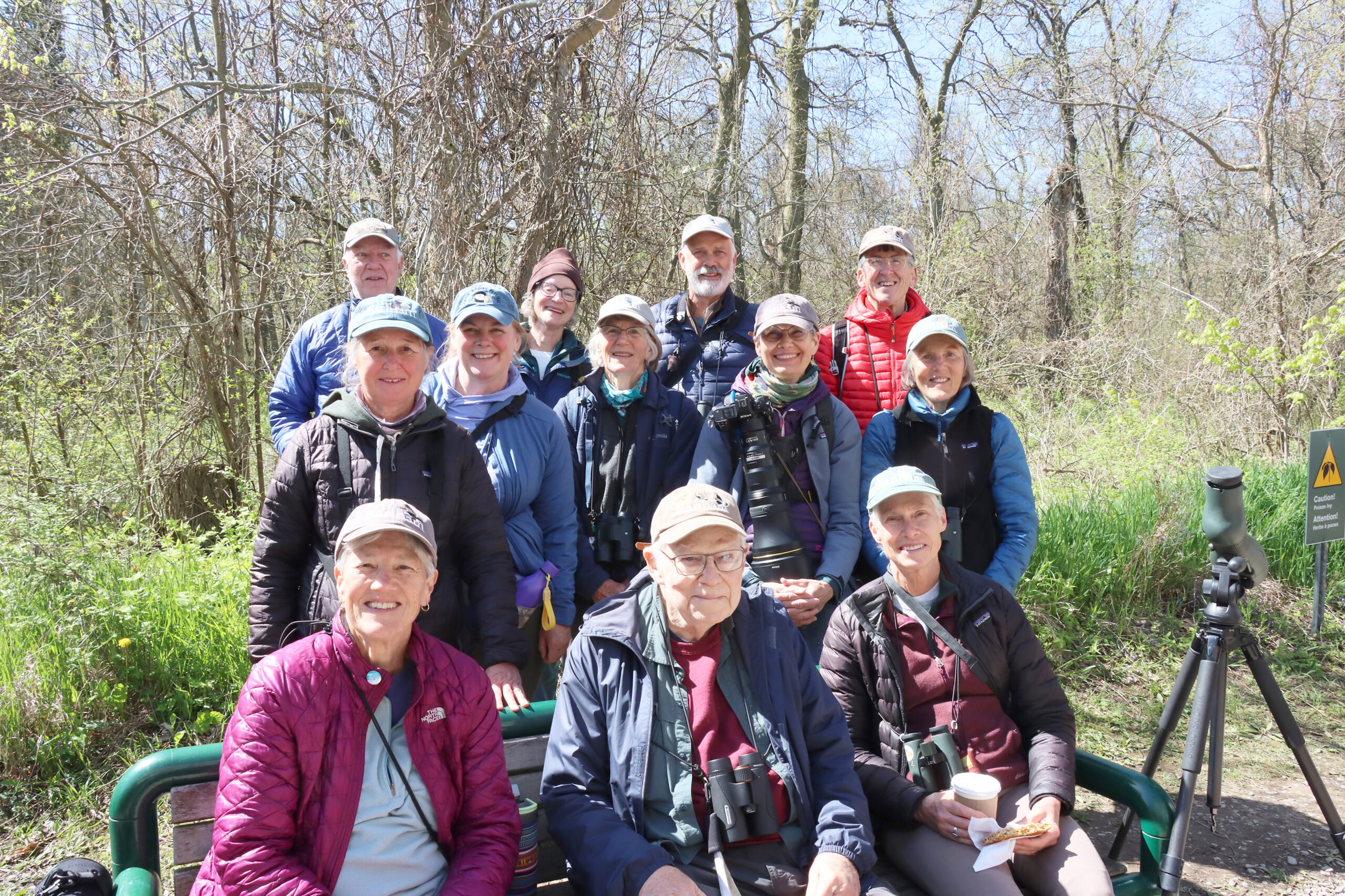 Bill Buskirk, sitting centre on the bench, was surrounded last year by former students — all from Earlham College in Richmond, Indiana. Buskirk and his colleague Jim Cope — both professors at Earlham — began bringing students to Point Pelee National Park in the 1970s.