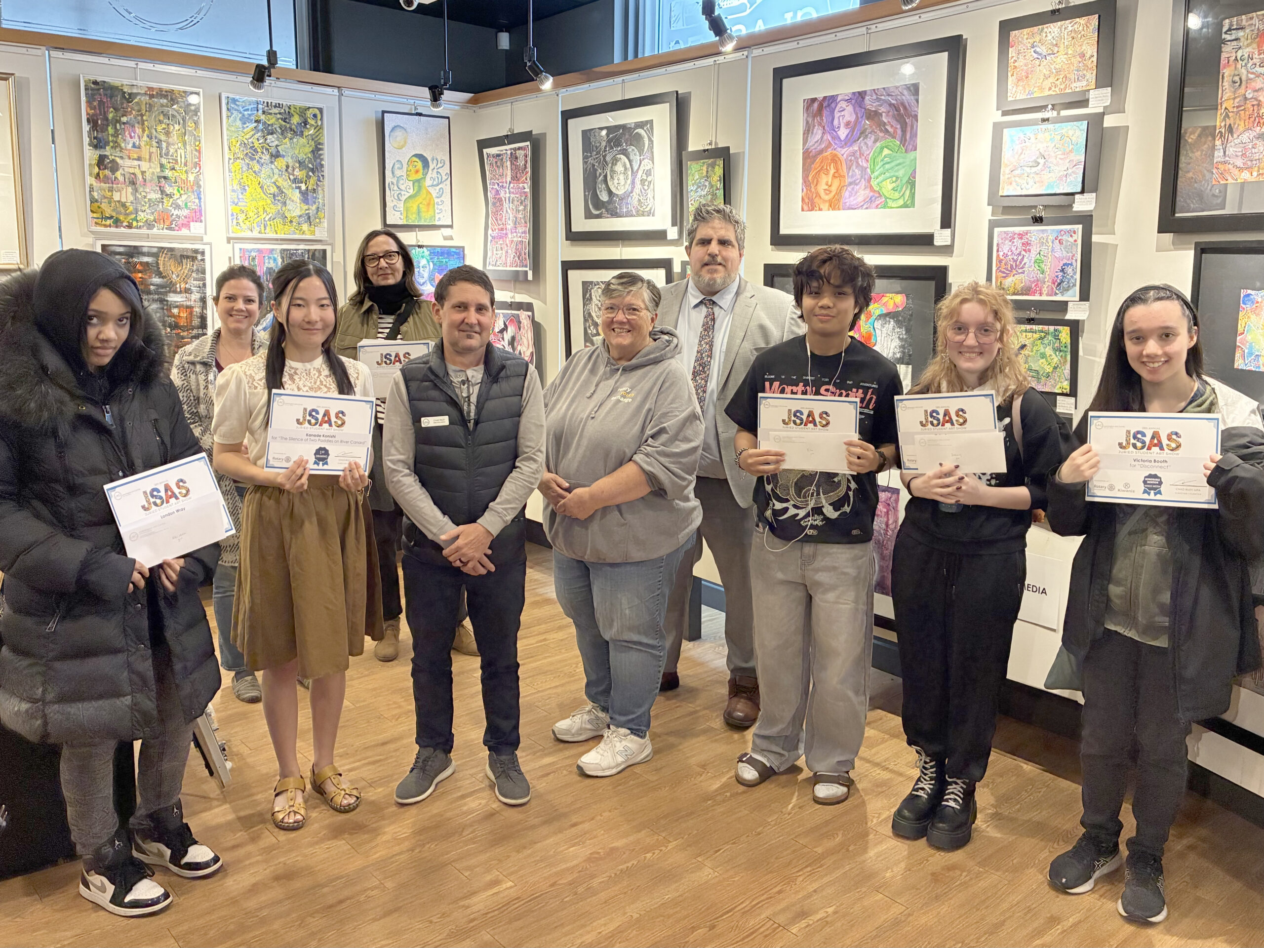 Surrounded by student art are some of the award winners from the 28th annual Juried Student Art Show at the Leamington Arts Centre. Pictured, in the front row, from the left, are London Wray of Cardinal Carter Catholic Secondary School, Kanade Konishi of North Star High School, LAC Director/Curator Chad Riley, Rotarian Wendy Parsons, Lance Principe of Cardinal Carter Catholic Secondary School, Keira Leary of St. Anne Catholic High School and Victoria Booth of Sandwich Secondary School. In the back are some of the teachers who came out to support their students at the competition.