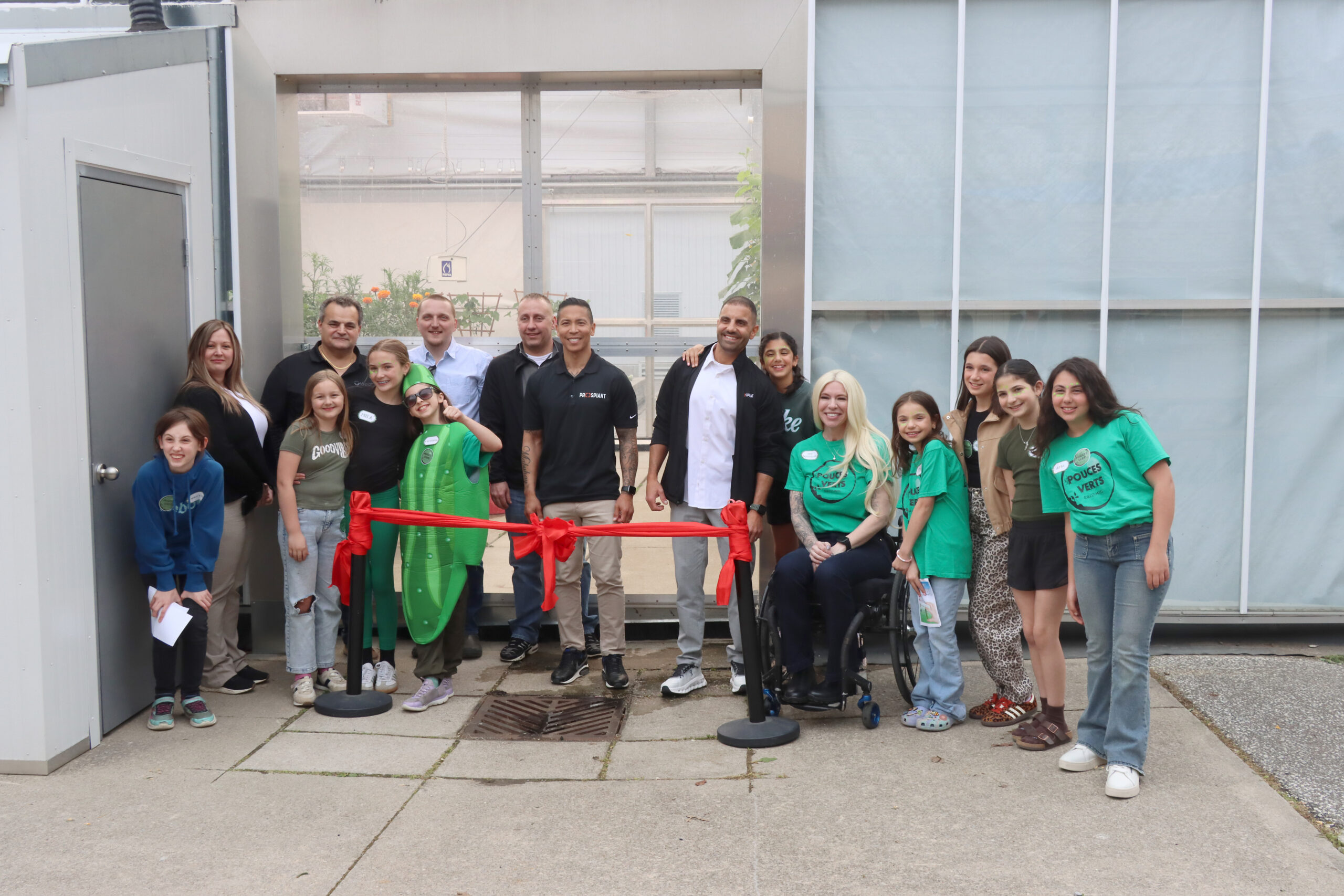 Cutting the ribbon, from left, are students Violette Pozzobon, Addilyn Bailey, Mila Lazdins, Victoria LaFrance, Clara Daher, Mme Serrah Gossmann, teacher and lead on greenhouse operations, Leah Massad, Milania Iacobelli, Evangeline Boutros and Aria Saba. In the back row are Brandi Bryne (Prospiant), Guy Totaro (Mucci Farms), Mitch Grant (Prospiant), Brad Crawford (Prospiant), Jason Baclig (Prospiant) and Tony Abbas (Prospiant). SUN photos by Mark Ribble