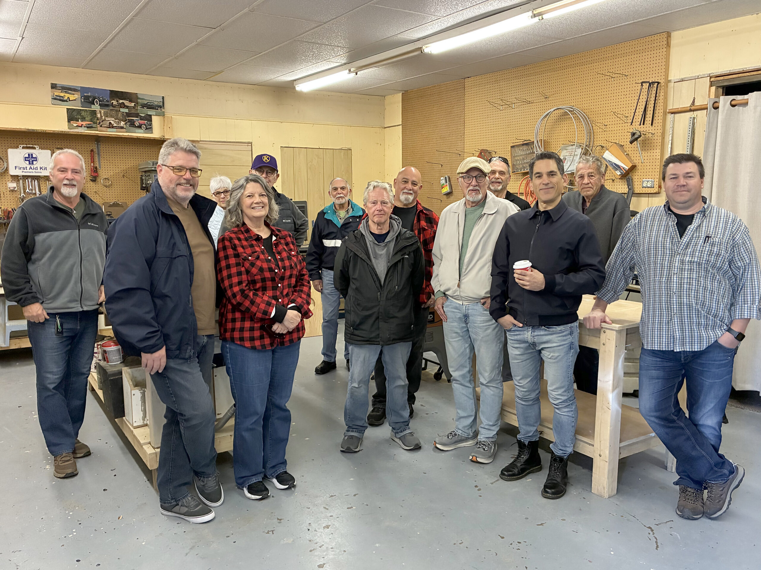 Interest from residents was evident at the open house of the Men’s Shed, some of whom are seen here in the shed along with a few of the organizing members. SUN photo by Paul Forman