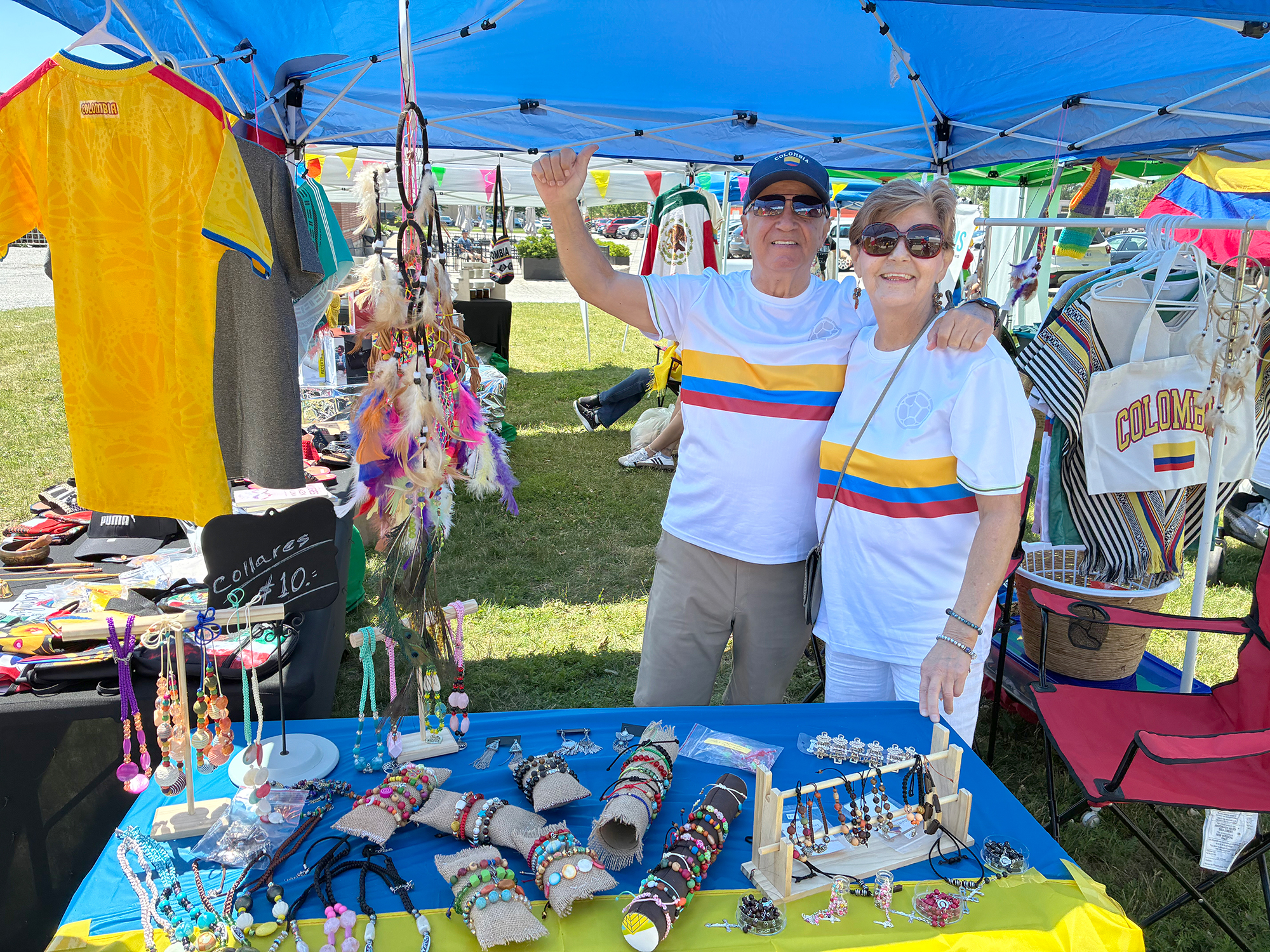 Vendors Jorge and Luz Vallejo sell ponchos and handmade jewellery at the Latino Village during Carousel of the Nations in Leamington.