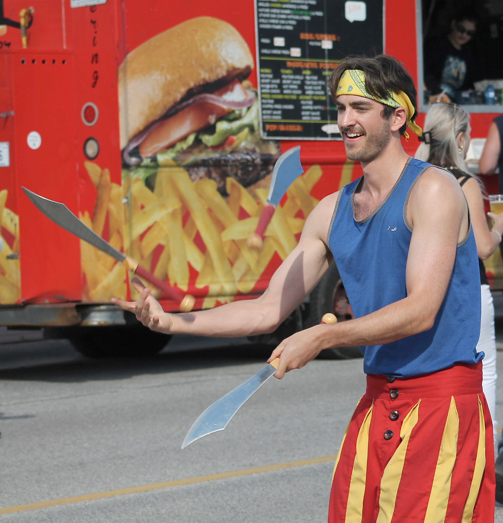 Entertainer Simon Zenker juggles for the crowd during The Simon Says Show at the Cottam Block Party in Cottam.