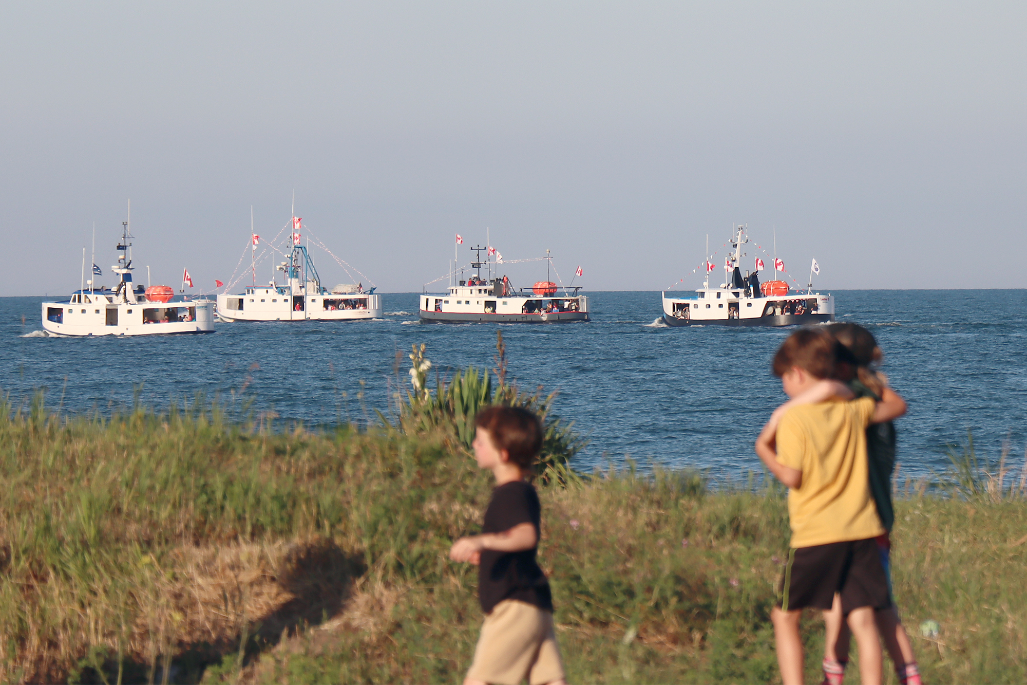 Fishing tugs and private boats take part in the annual boat parade at Wheatley Harbour during the Wheatley Fish Festival.