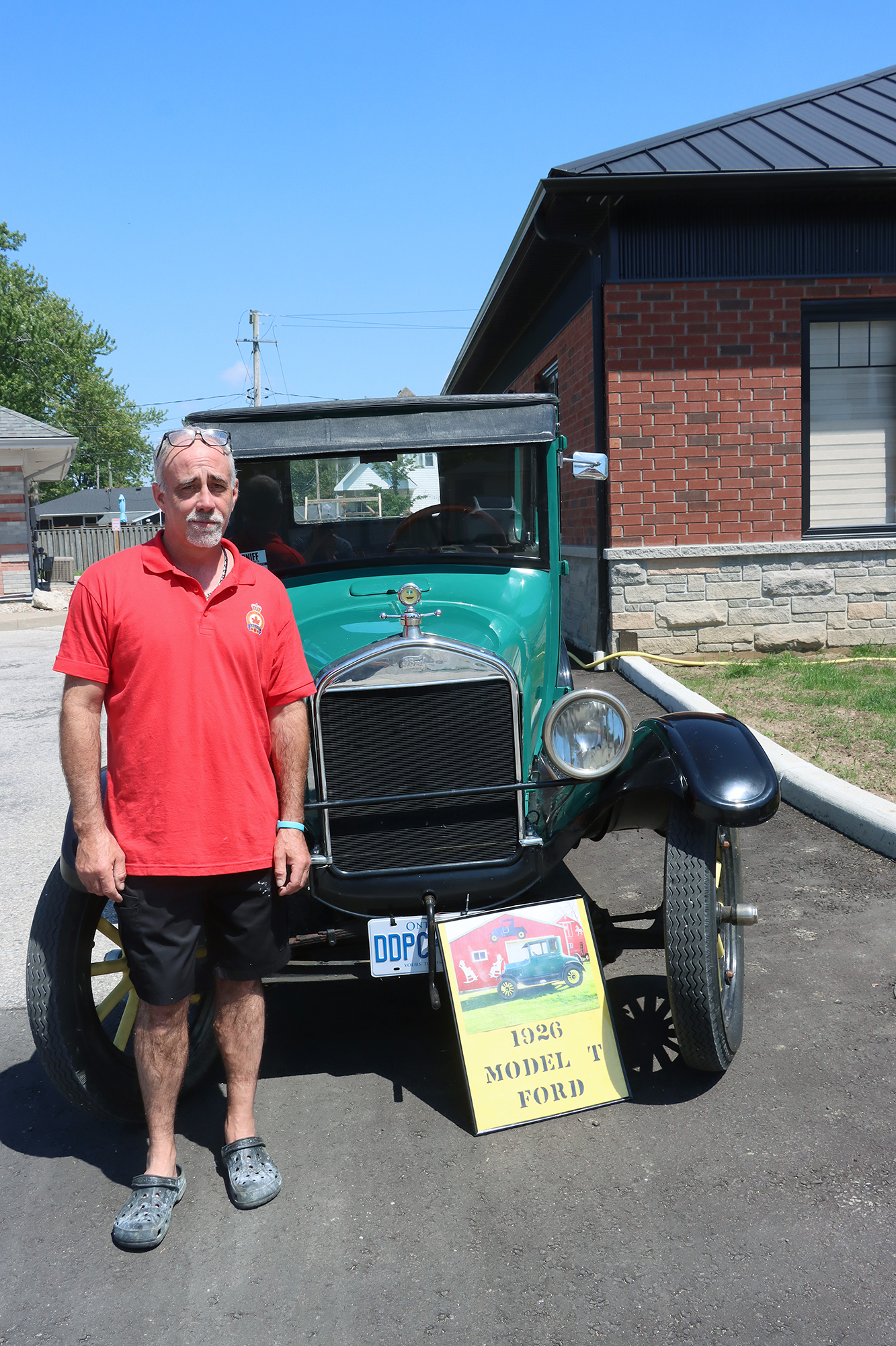 Tom Brown stands beside his 1926 Model T Ford during the Fish Festival Car Show in Wheatley.