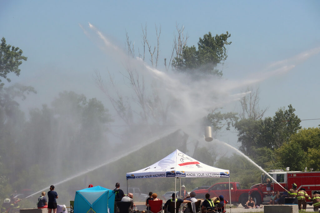 Firefighters compete in the annual water barrel competition at Wheatley Harbour during the Wheatley Fish Festival.