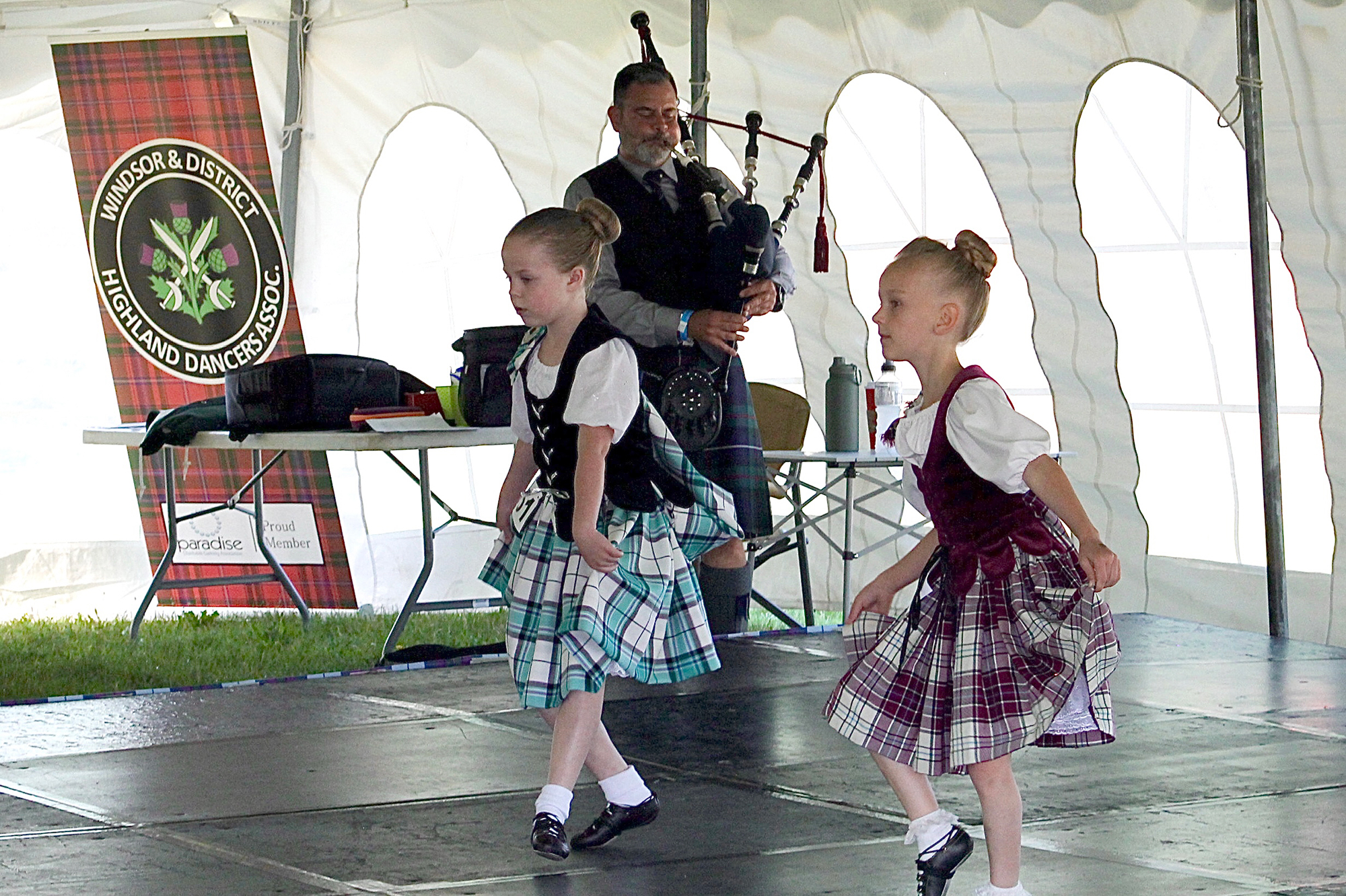 Novice Highland dancers perform during a competition in the dance tent at the Kingsville Highland Games.