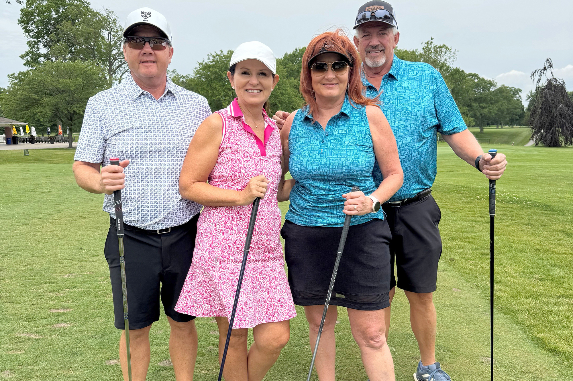Mixed team champions Abe Friesen, Sarah Friesen, Mary Fehr and Bill Fehr celebrate their victory at the HL Tiessen Foundation golf tournament.
