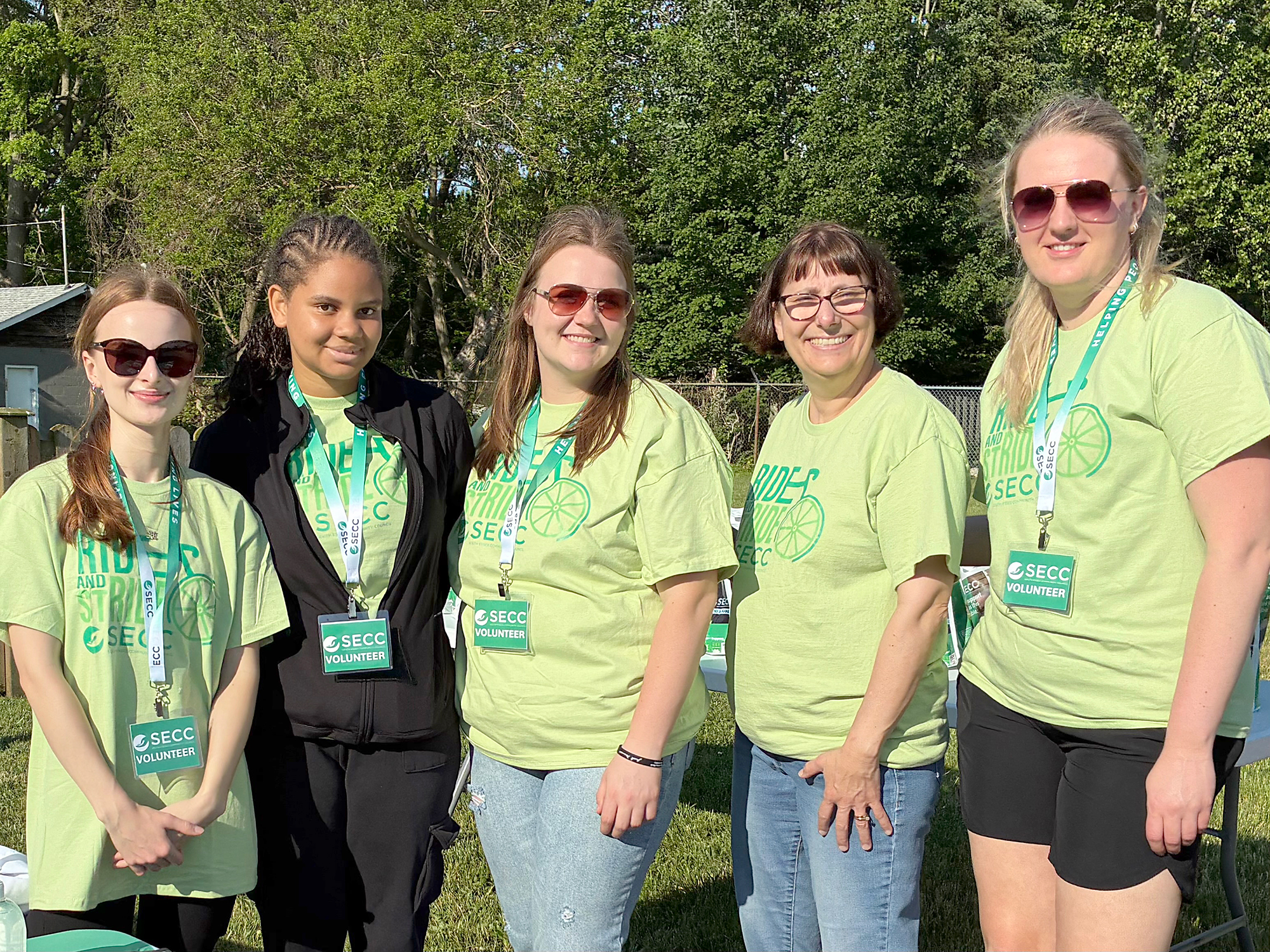 South Essex Community Council volunteers register participants and hand out event swag during the Ride and Stride fundraiser in Kingsville.