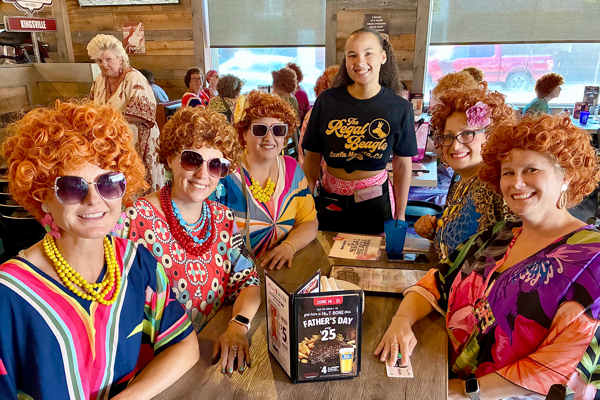 Mrs. Roper Romp participants Donna Stickles, Julie Hartwick, Lisa Desborough, Diana Bommarito and Danielle Barnewall gather around a table at Chuck's Roadhouse in Kingsville.