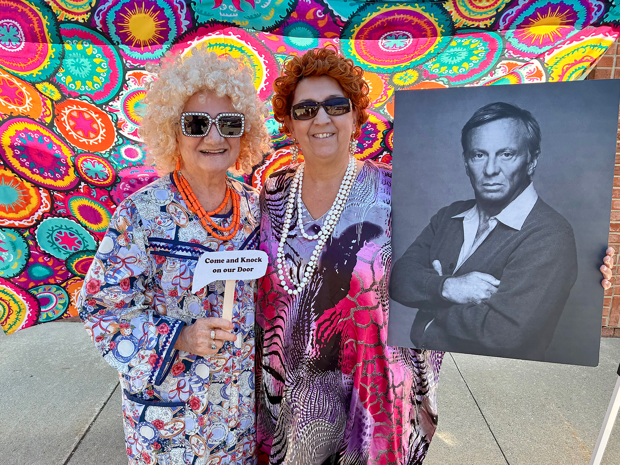 Mrs. Roper Romp participants Rita Wrobel and Lynn Heroux pose with a Stanley character at the rehydration station outside Wrobel Plaza in downtown Kingsville.