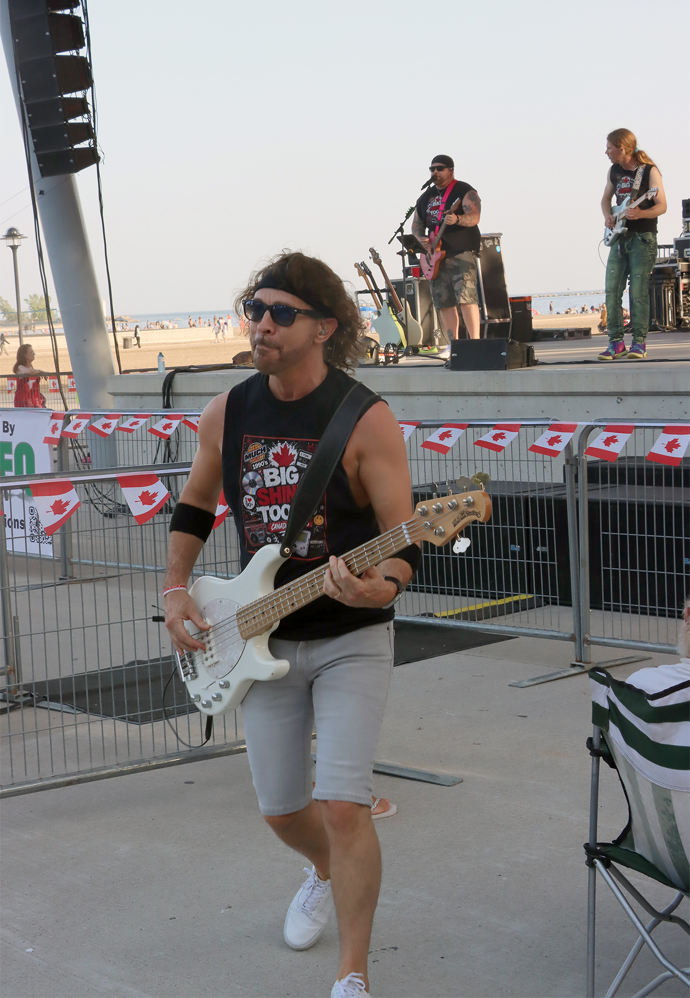 Big Shiny Toons bassist Brian McDonnell performs among the crowd during the Canada Day concert at Seacliff Park in Leamington.