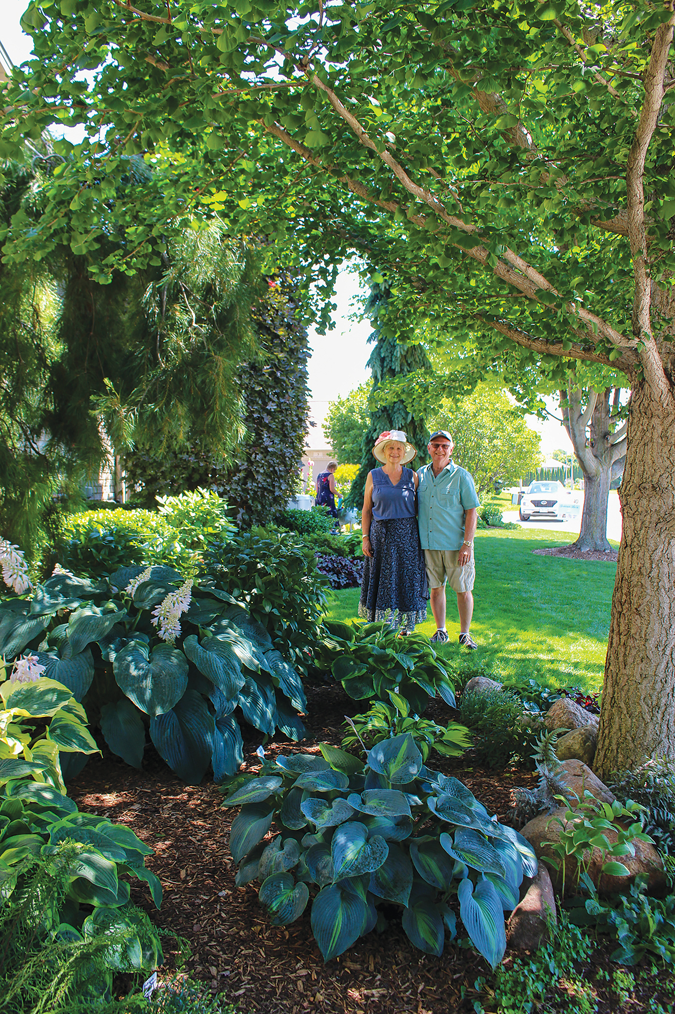 Don and Deb Neufeld stand in their Sand Pebble Crescent garden featuring more than 50 varieties of hostas during the Kingsville Garden Tour.