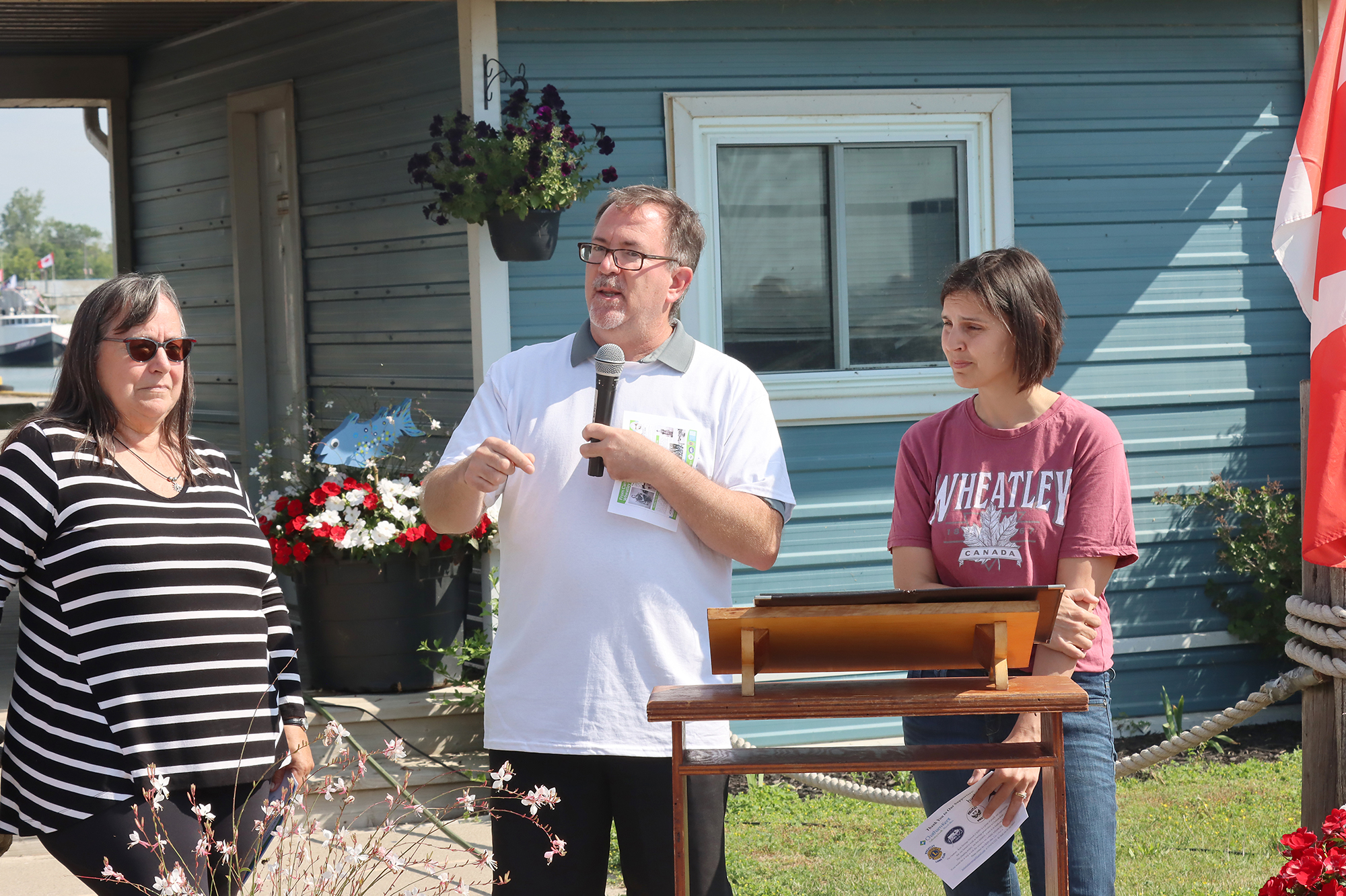 Heritage Network Chair Lisa Gilbert stands with Chatham-Kent Mayor Darrin Canniff and Ward 1 Councillor Melissa Harrigan during the unveiling of Wheatley's fishing heritage plaque.