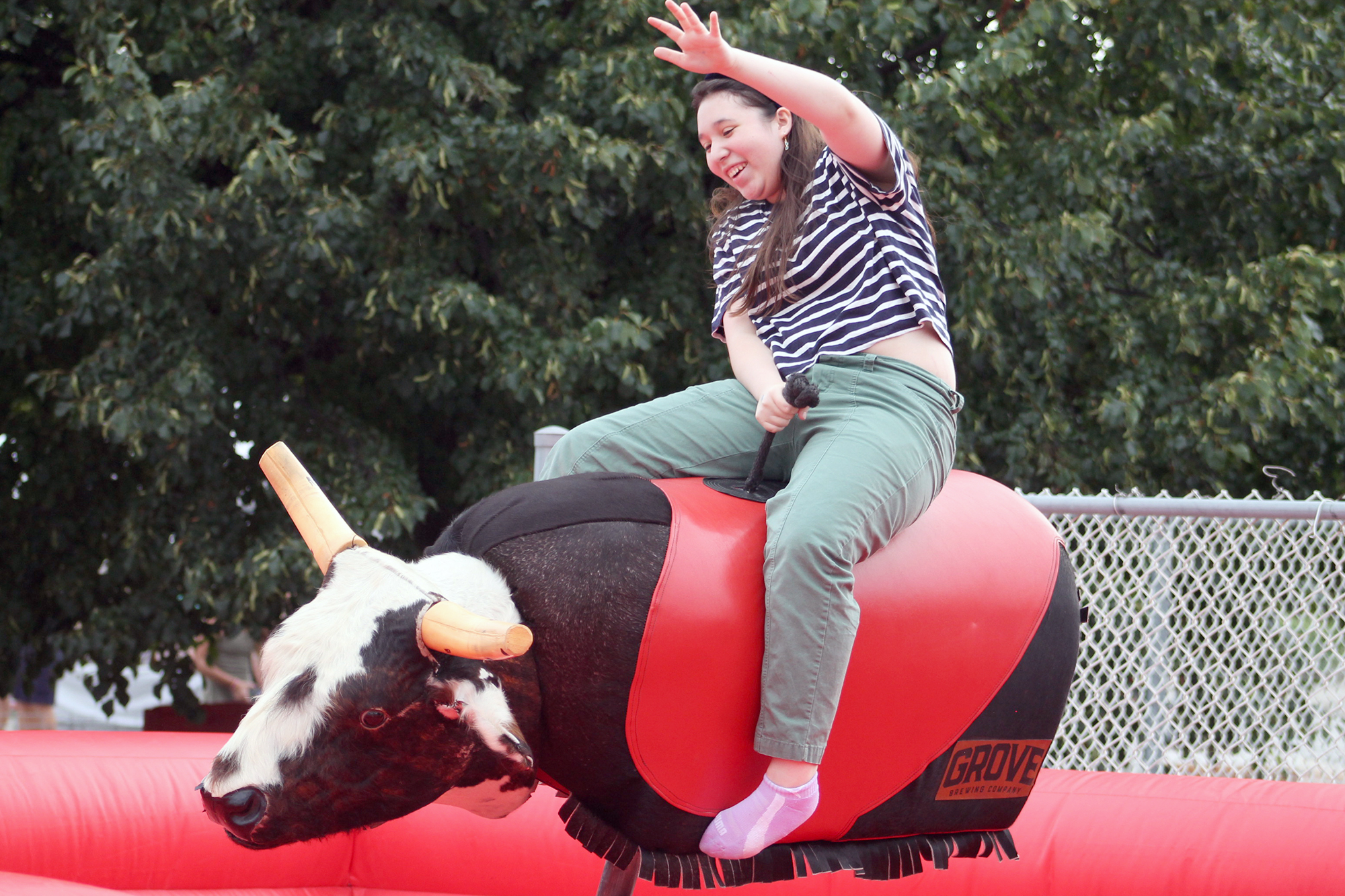 Rafaela Alvarez rides the Kingsville Pro Rodeo mechanical bull at the Kingsville Country Night Block Party.