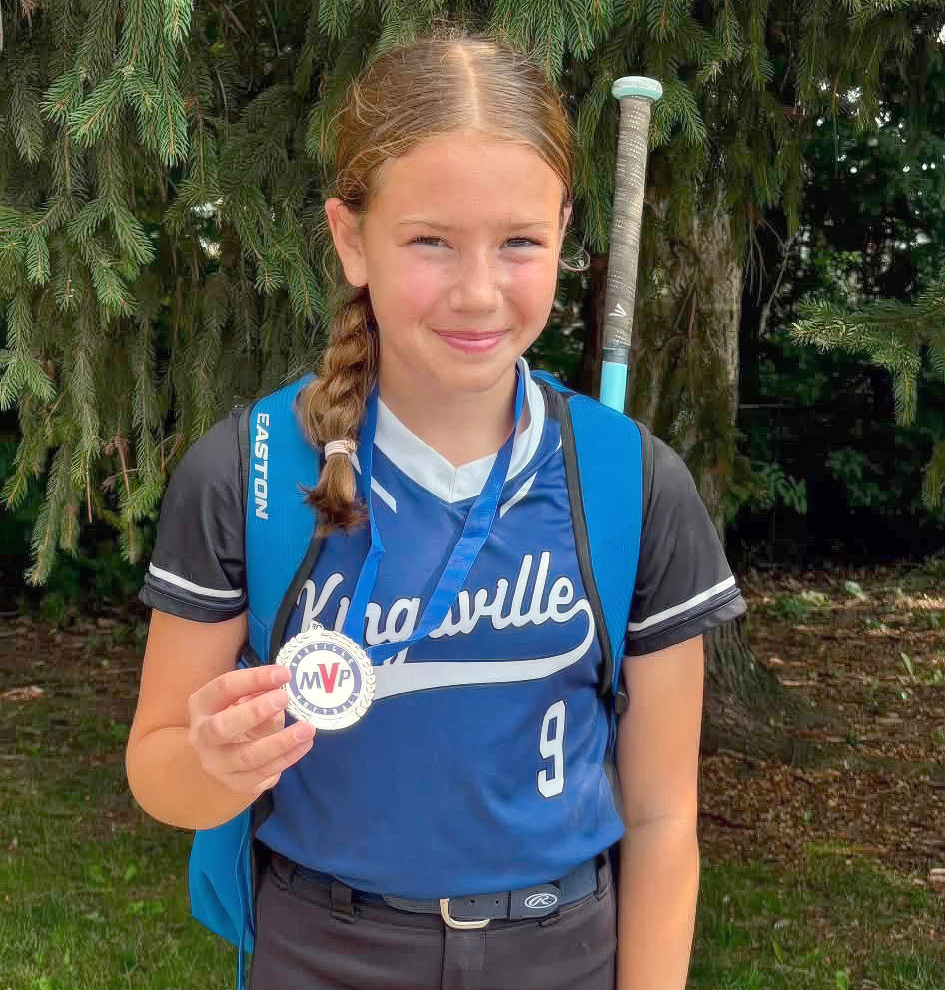 Maya Carey of the U13 Kingsville Knights poses with her MVP medal.
