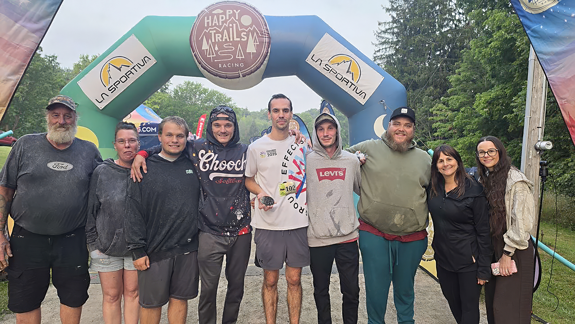 Chas Allison poses with his family and support crew after completing the Tally in the Valley 100-mile ultra marathon in Dundas, Ontario.