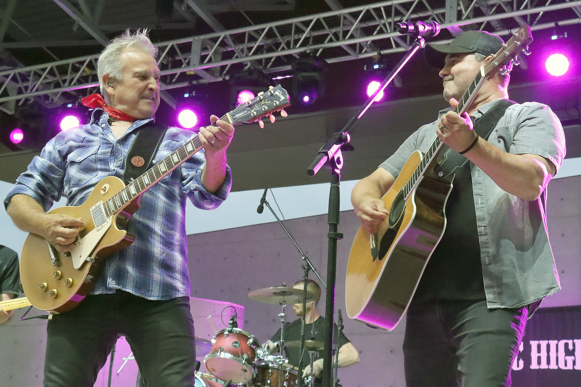 Mystic Highway frontman Gil Gaidola performs alongside rhythm guitarist Larry Melo on the Sunset Amphitheatre stage in Leamington.