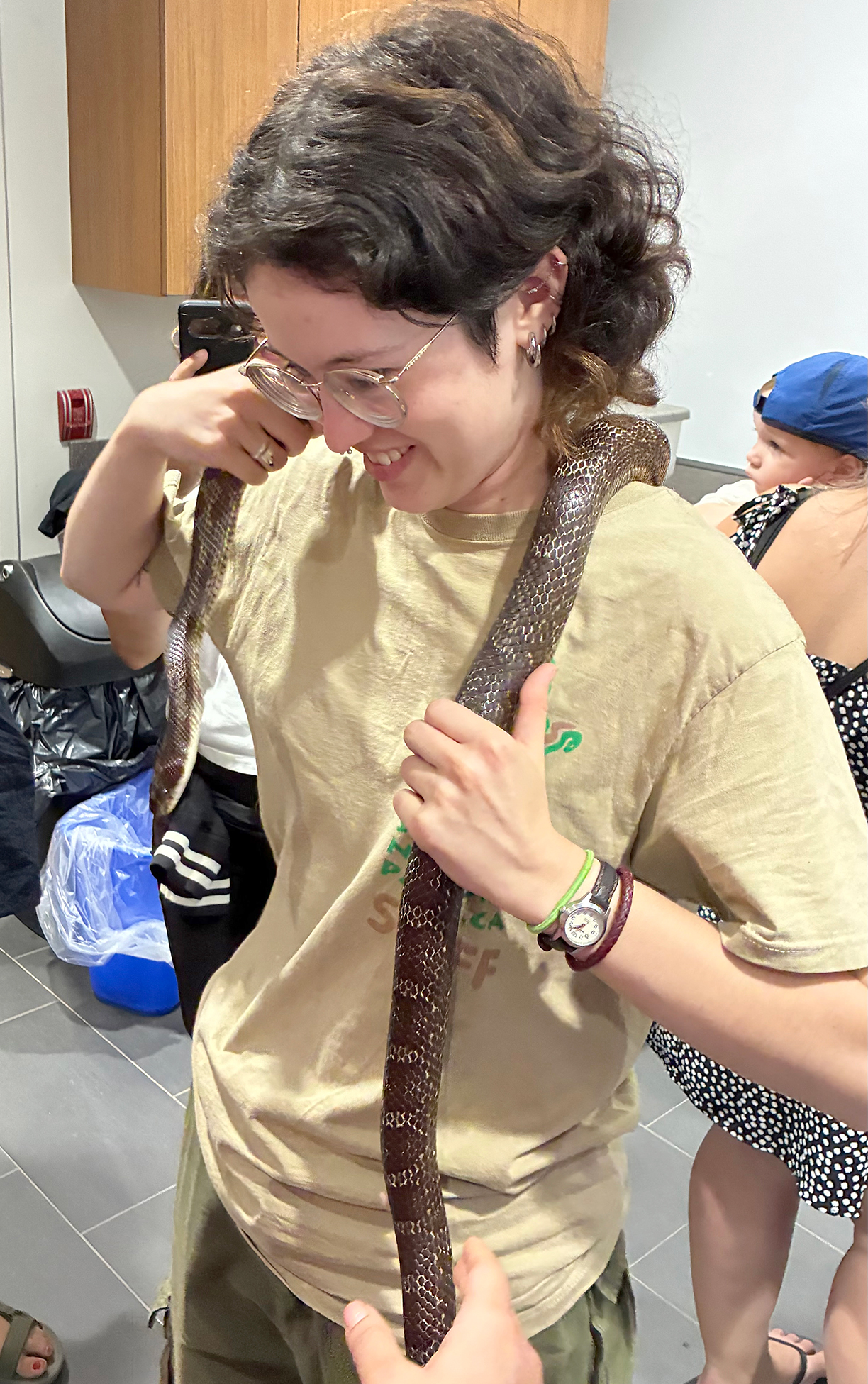 Gab Diez of Scales Nature Park holds a large snake during the reptile meet and greet at Point Pelee National Park.