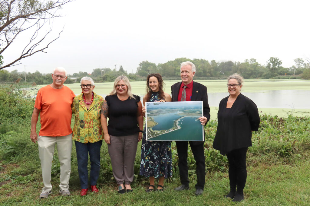 A happy group at the Hillman Marsh Restoration Project announcement. From left are Wayne King, Leamington Mayor Hilda MacDonald, Caldwell Chief Nikki van Oirschot, ERCA Chair Molly Allaire, ERCA CEO Tim Byrne and Véronique Hiriart-Baer of the Canada Water Agency.