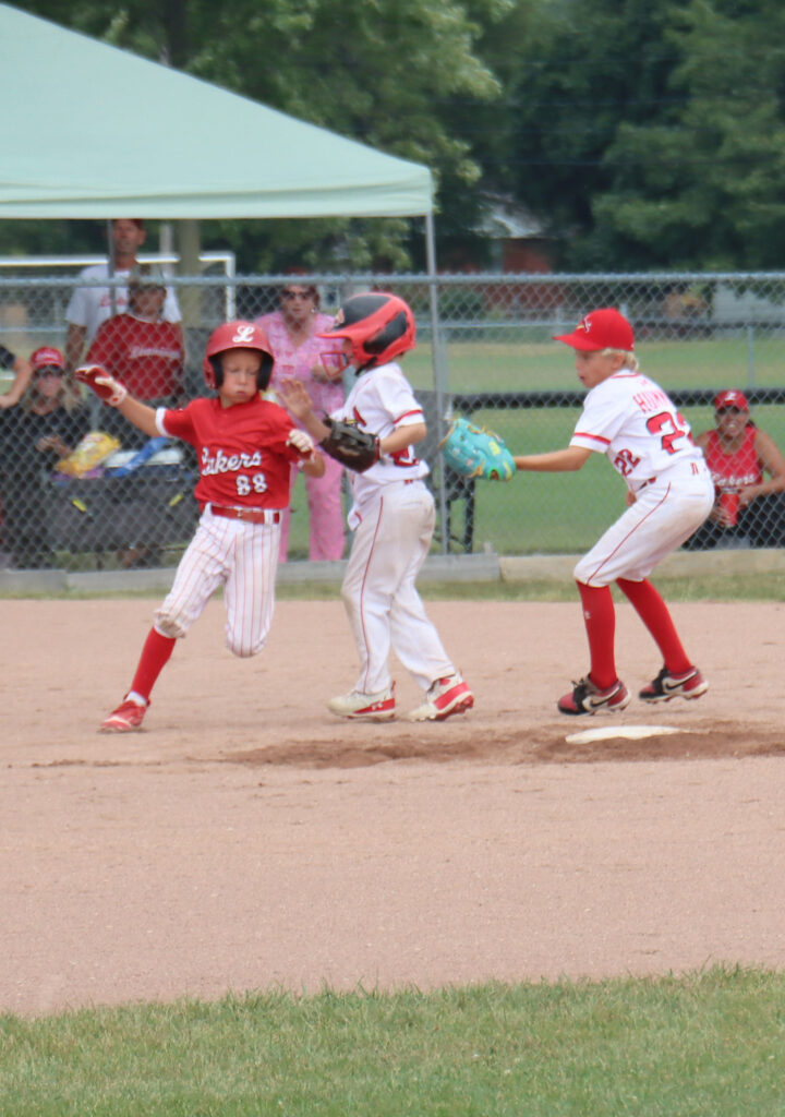 Leamington Lakers runner Nash O’Neil scrambles to return to second base after a rundown during the OBA championship game on Sunday at the Kinsmen Ball Diamonds. O’Neil was ruled safe on the play due to fielder interference. The Lakers won the game over St. Thomas by a 15-5 score.
