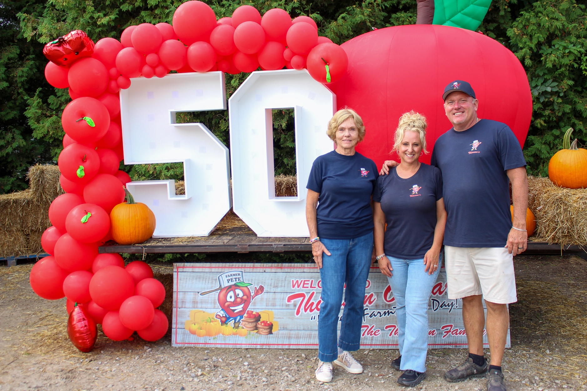 Gloria, Krissy and Andrew Thiessen at the orchard Saturday morning at Thiessen Orchards in Leamington