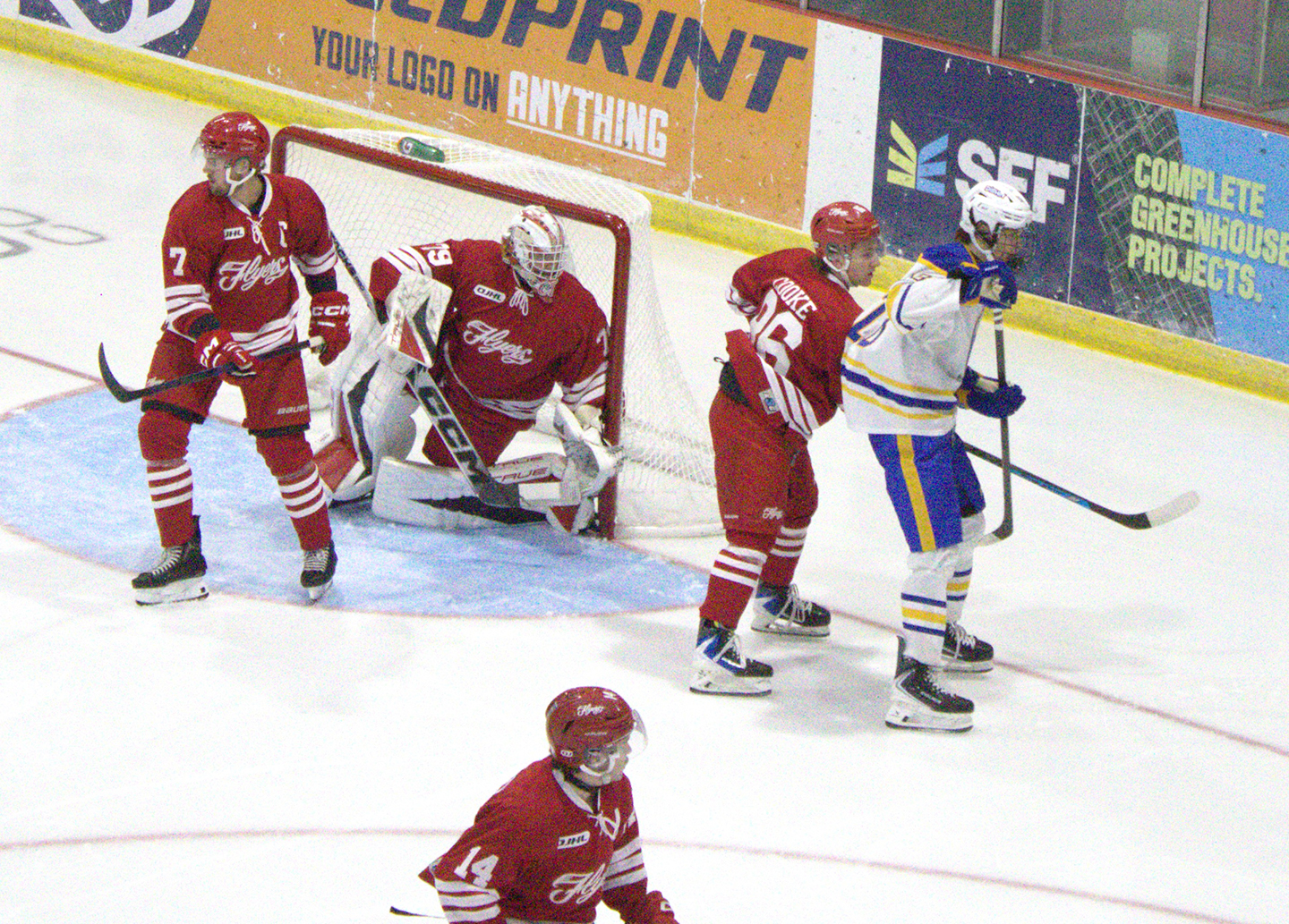 Flyer Brendan Cooke (86) hinders a Sabres’ player while Joshua Cleary (14), defenseman Tyler McGuire (7) and goalie Colten Drillen-Roach track the puck during last Thursday’s home game. C. Scott Holland photo