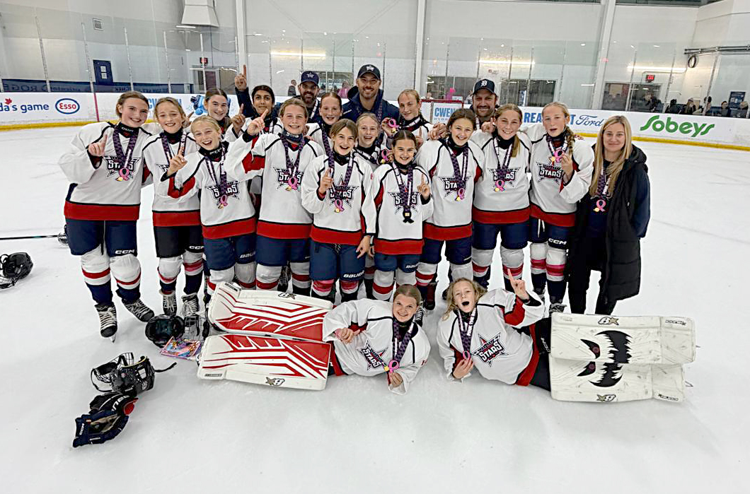 The U13 Pink the Rink champs are, back row, from left, Coaches Curtis Anderson, Mark Epplett and Ian Ruston. Third row: Dylynn McLean, Mila Antonios, Sarah Beaudoin, Tegan Grubb, Mila Epplett. Middle row: Scarlett Graham, Logan Drozdz, Maddy Staadegaard, Emma Robinson, Victoria Missal, Brooke Huston, Elyse Harnden, Peyton Ruston, Ella Epplett, trainer Megan Huston. In front are Avery Anderson and Evie Cecile.